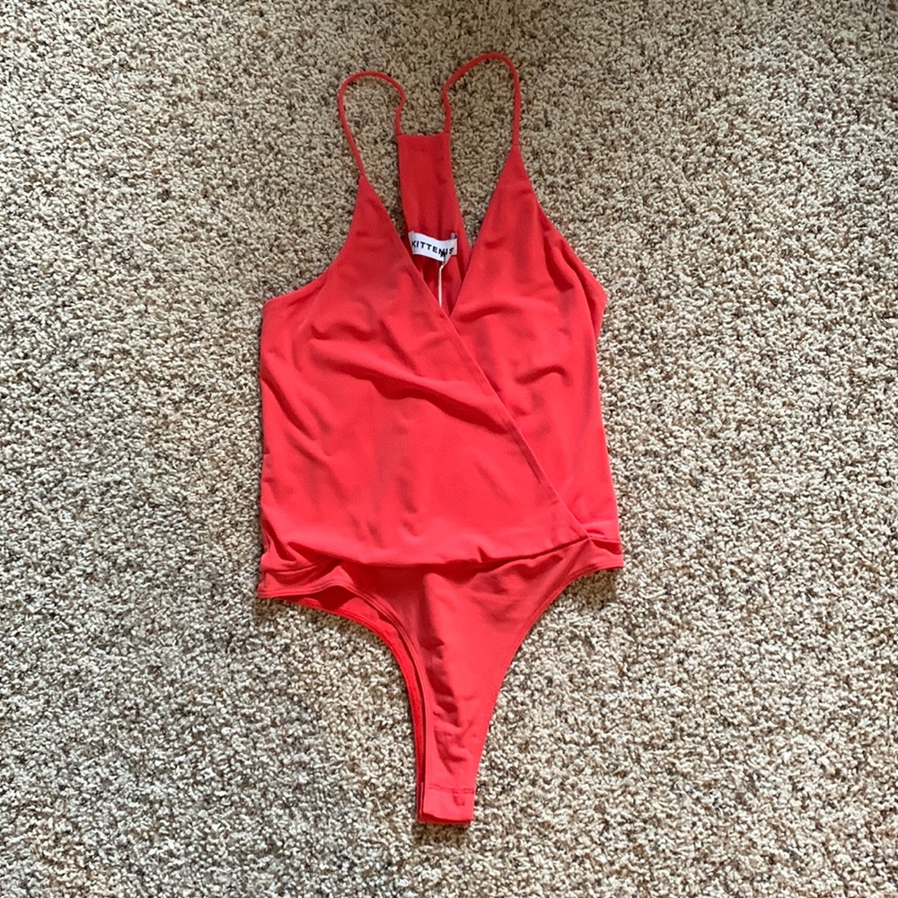 Kittenish body suit. New with tags!